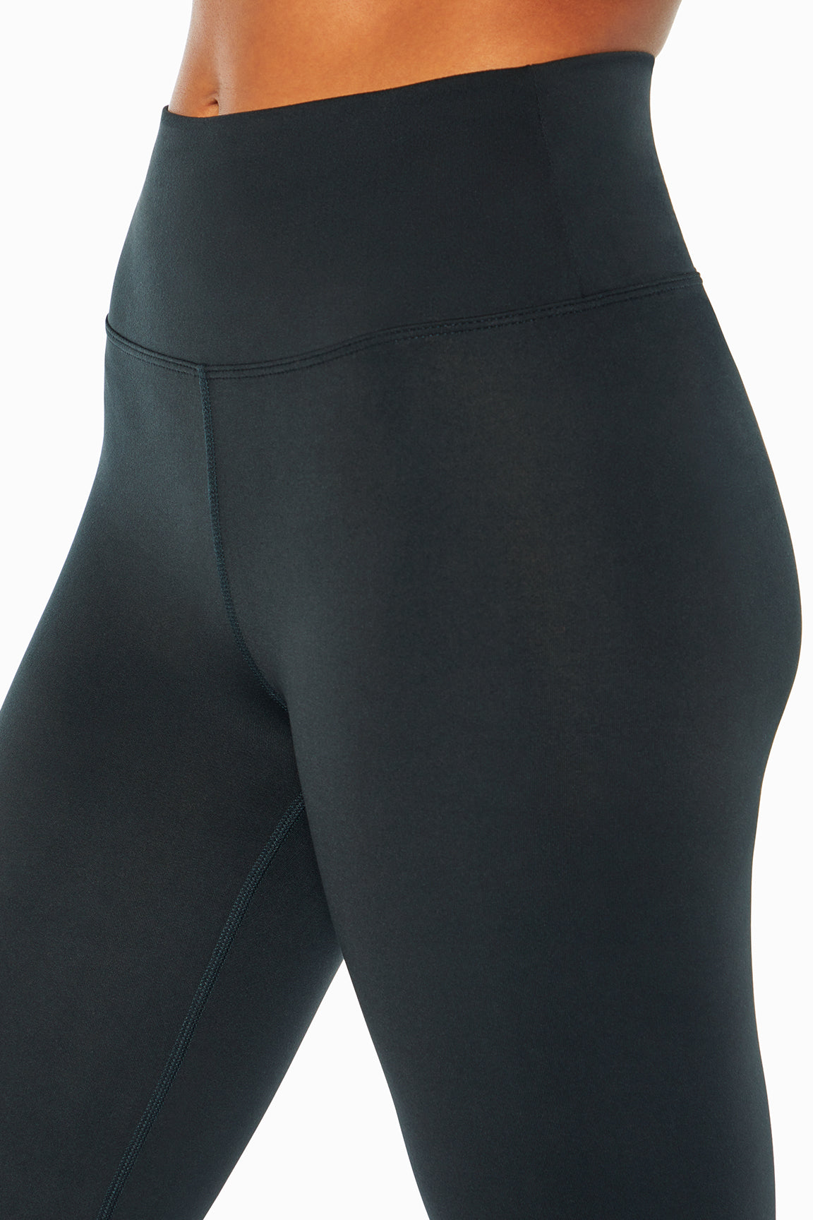 Balance Collection Barely Flare Pant, close-up view of fabric and stitching, showing visible design features and texture of the durable stretch..