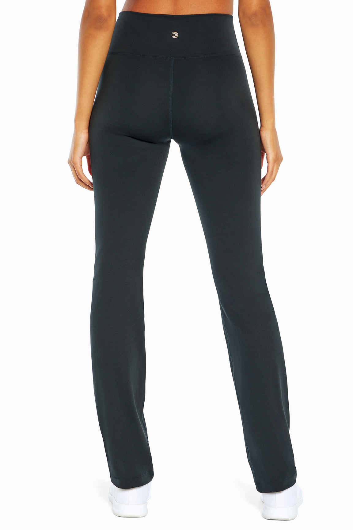 Balance Collection Barely Flare Pant, back view, showing visible design features and texture of the durable stretch fabric..