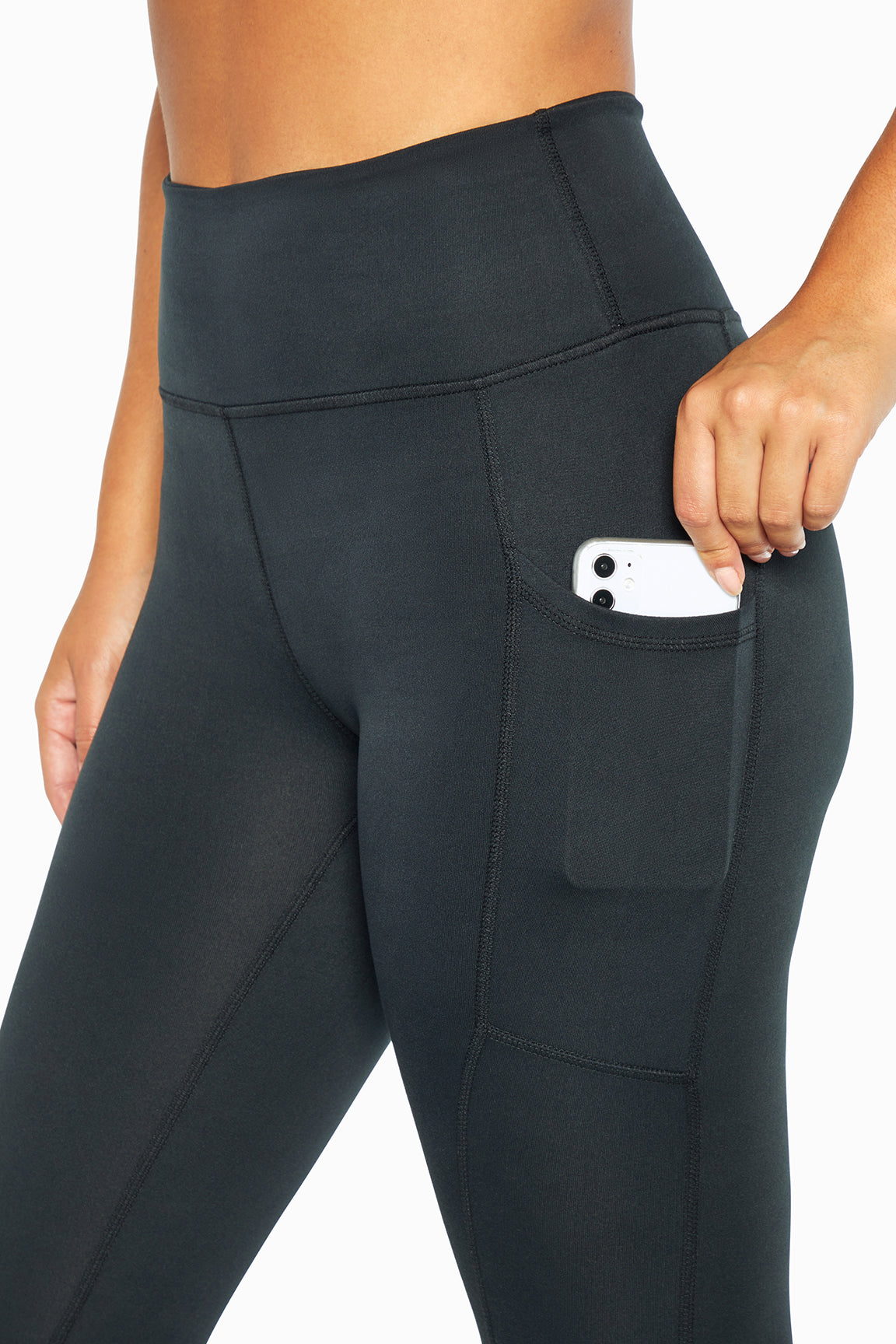 Balance Collection Easy Eclipse Side Pocket Ankle Legging - Black, back view, showing visible design features and texture of the stretch knit fabric..