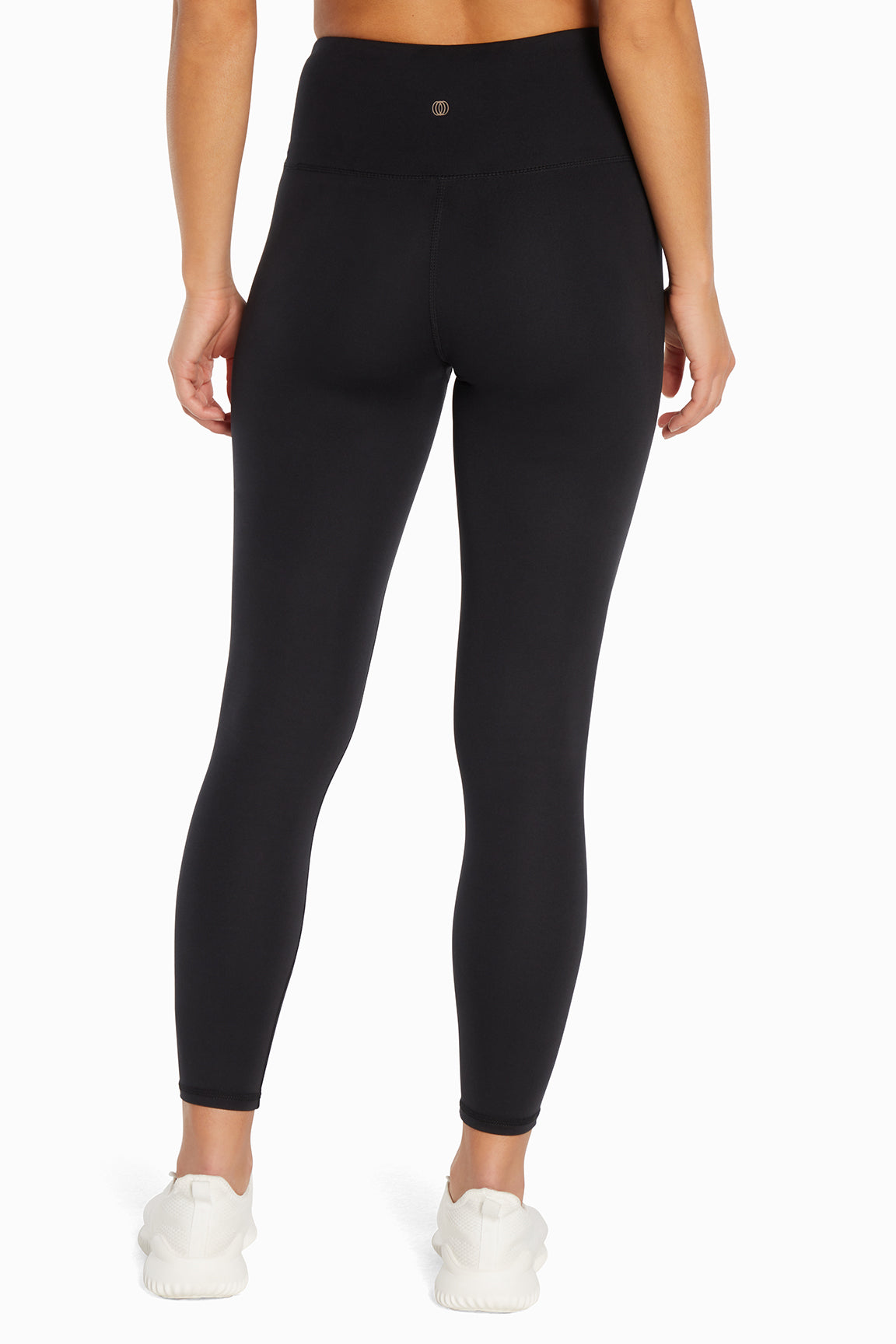 Balance Collection Crossover Legging, back view, showing visible design features and texture of the stretch knit fabric..