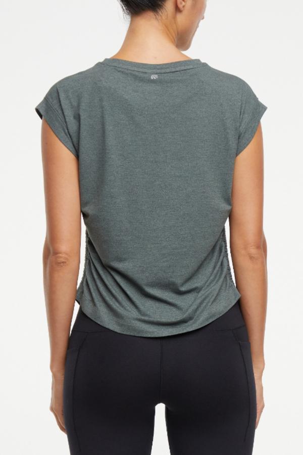Zoey Short Sleeve Top, side view showing pocket placement, showing visible design features and texture of the soft knit fabric..