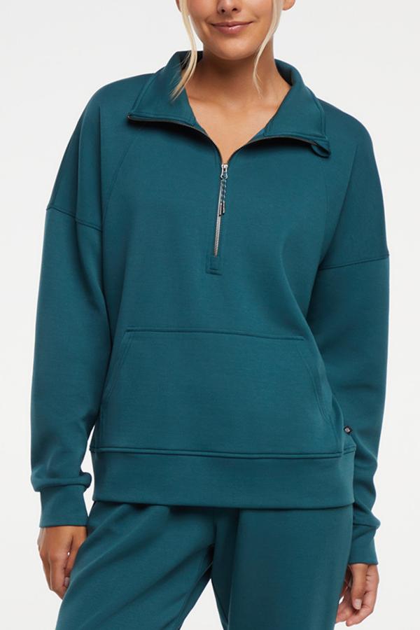 Sage 1/2 Zip, close-up view of fabric and stitching, showing visible design features and texture of the soft knit fabric..