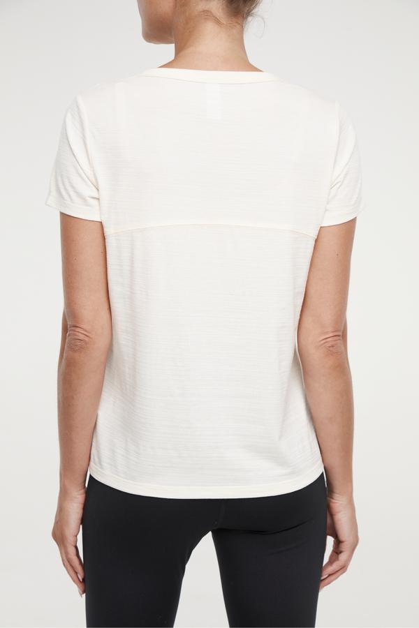 Harmony Short Sleeve Tee, side view showing pocket placement, showing visible design features and texture of the soft knit fabric.