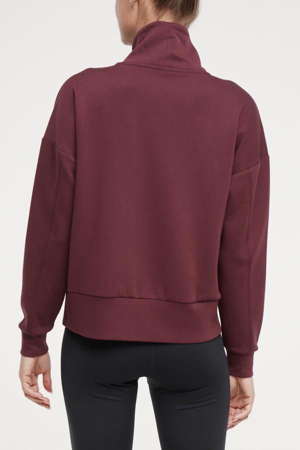 Sage Knit Pullover, side view showing pocket placement, showing visible design features and texture of the soft knit fabric..