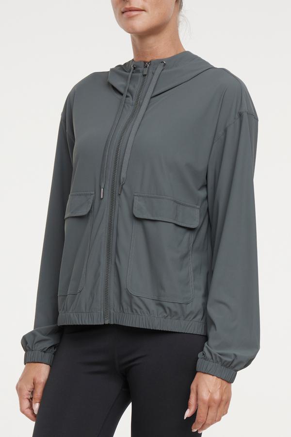 Nori Jacket, close-up view of fabric and stitching, showing visible design features and texture of the smooth woven fabric..