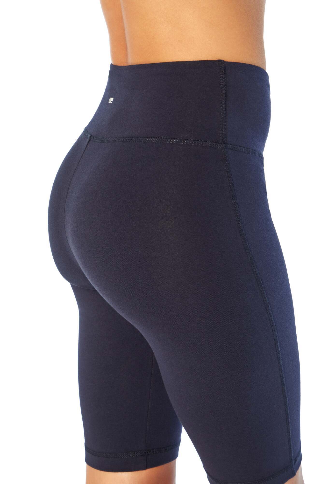 Becca Tummy Control Bermuda Shorts, back view, showing visible design features and texture of the soft knit fabric..