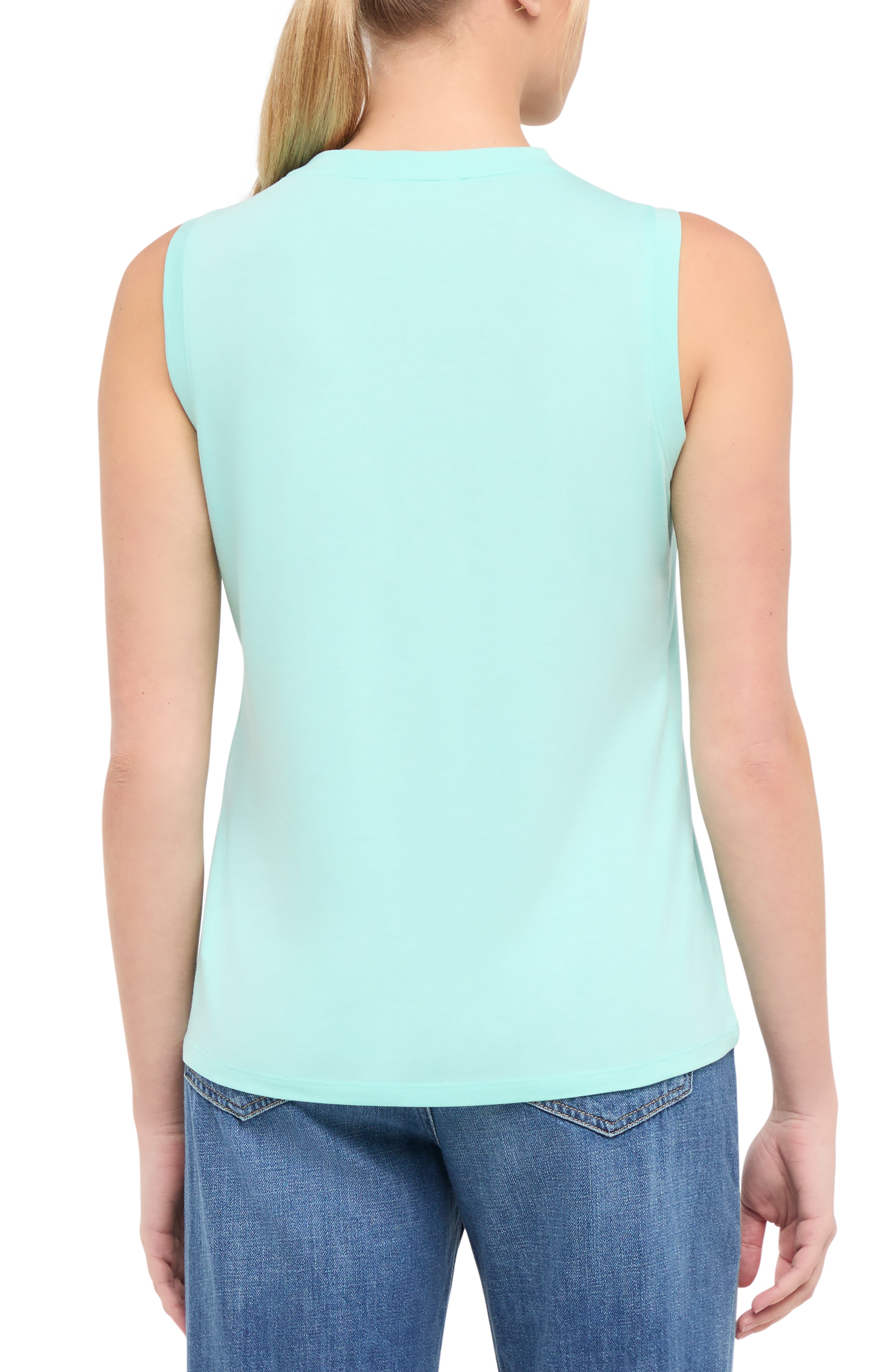 Back view of woman wearing a light teal blue sleeveless shirt on a white background.