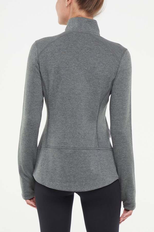 Journey Full Zip Jacket, side view showing pocket placement, showing visible design features and texture of the smooth woven fabric..