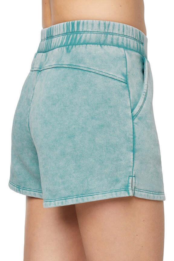 Elle Short, side view showing pocket placement, showing visible design features and texture of the soft knit fabric..