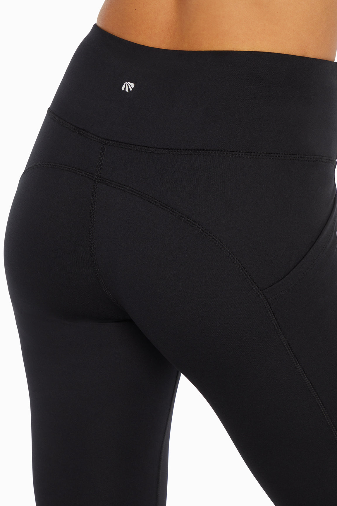 Kira Side Pocket Ankle Legging - Black, side view showing pocket placement, showing visible design features and texture of the stretch knit fabric..