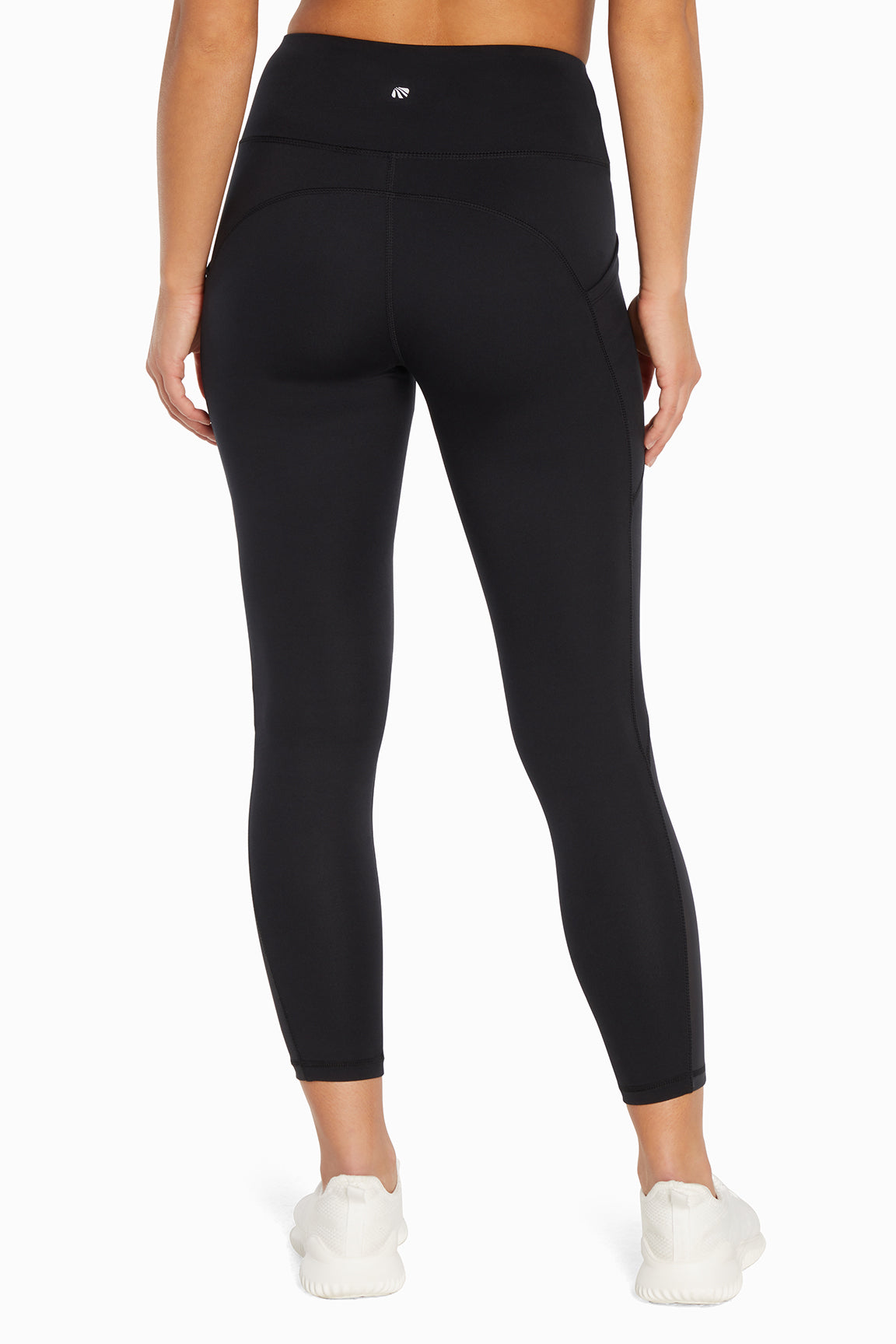 Kira Side Pocket Ankle Legging - Black, back view, showing visible design features and texture of the stretch knit fabric..