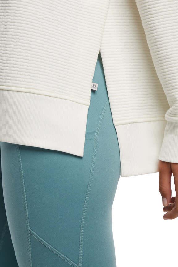 Cora Pullover Hoodie, alternate angle view, showing visible design features and texture of the soft fleece fabric..