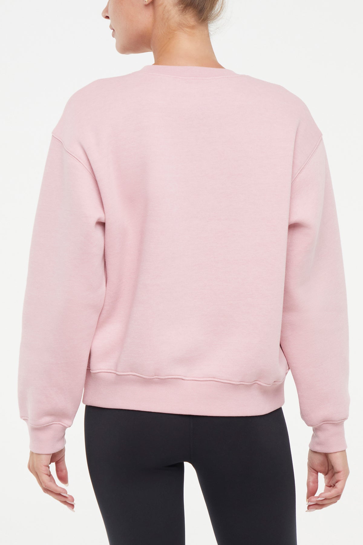 Meira Fleece Sweatshirt, side view showing pocket placement, showing visible design features and texture of the soft knit fabric..