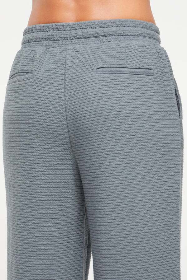 Freyi Pant, back view, showing visible design features and texture of the durable stretch fabric..