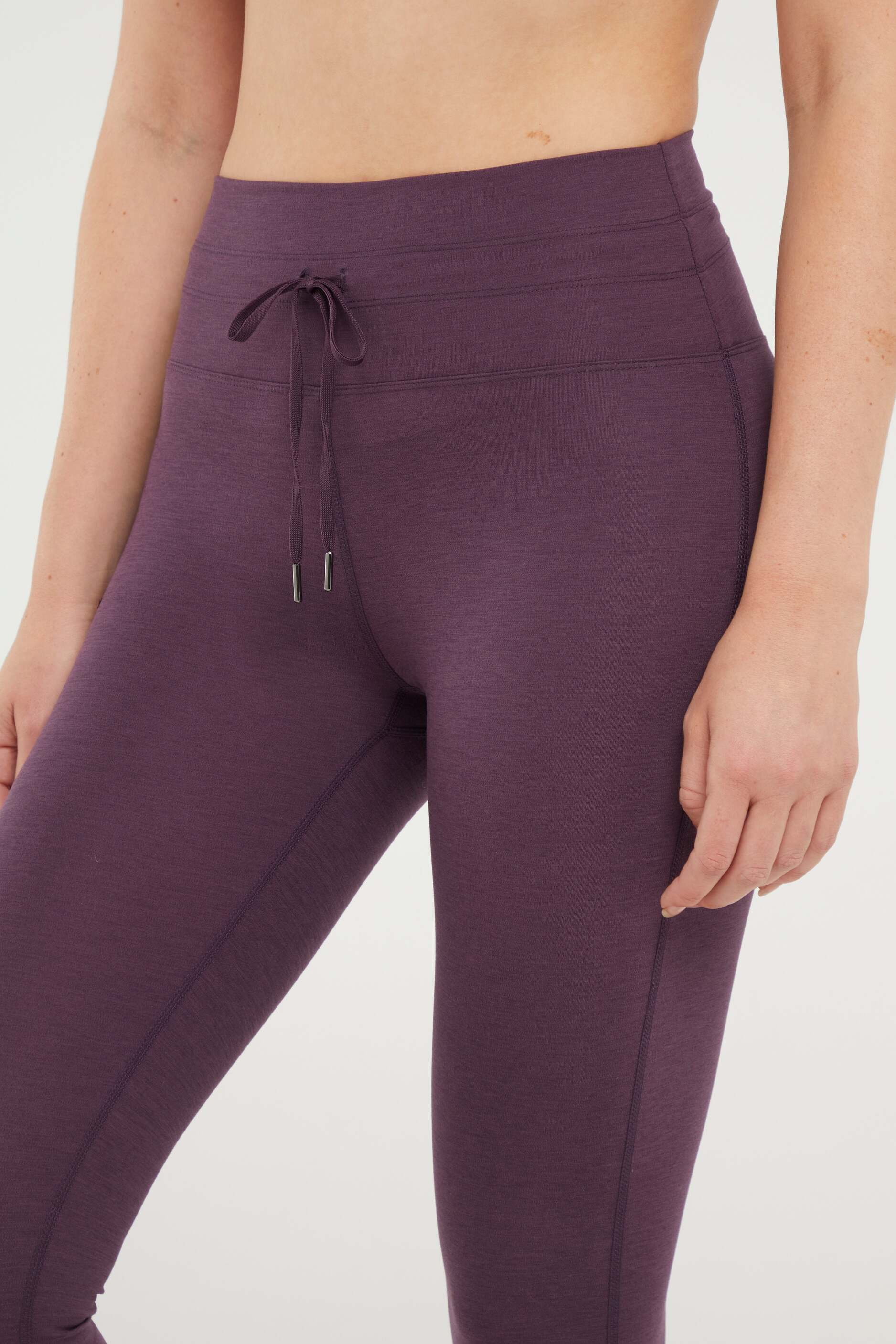 Lune Legging, close-up view of fabric and stitching, showing visible design features and texture of the stretch knit fabric..