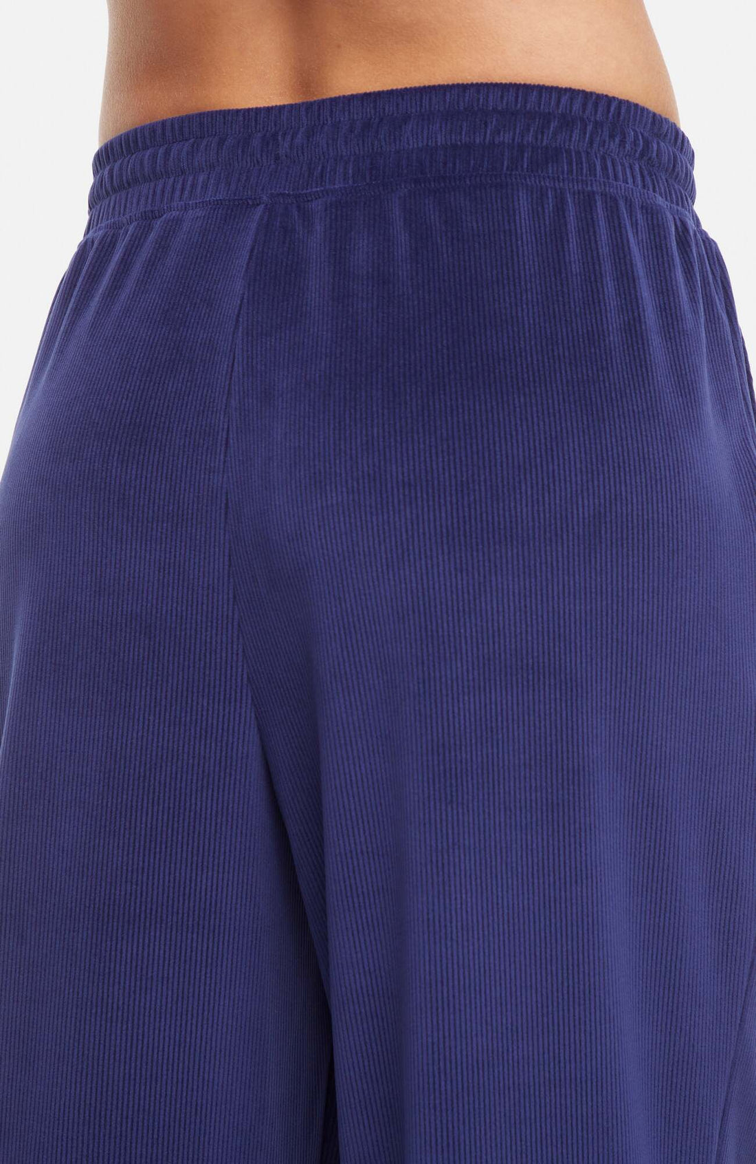 Stormi Pant, side view showing pocket placement, showing visible design features and texture of the durable stretch fabric..