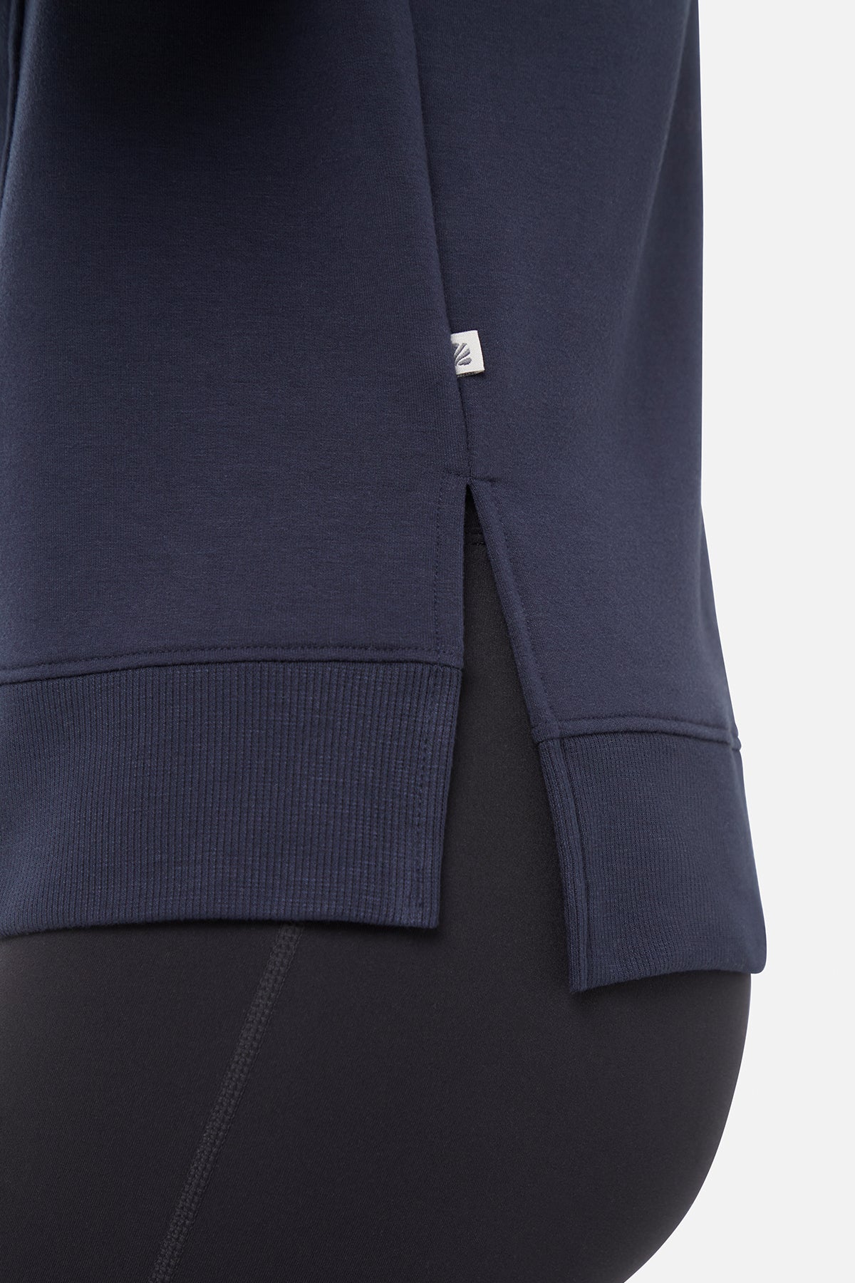 Maisha Long Sleeve Pullover, back view, showing visible design features and texture of the soft knit fabric..