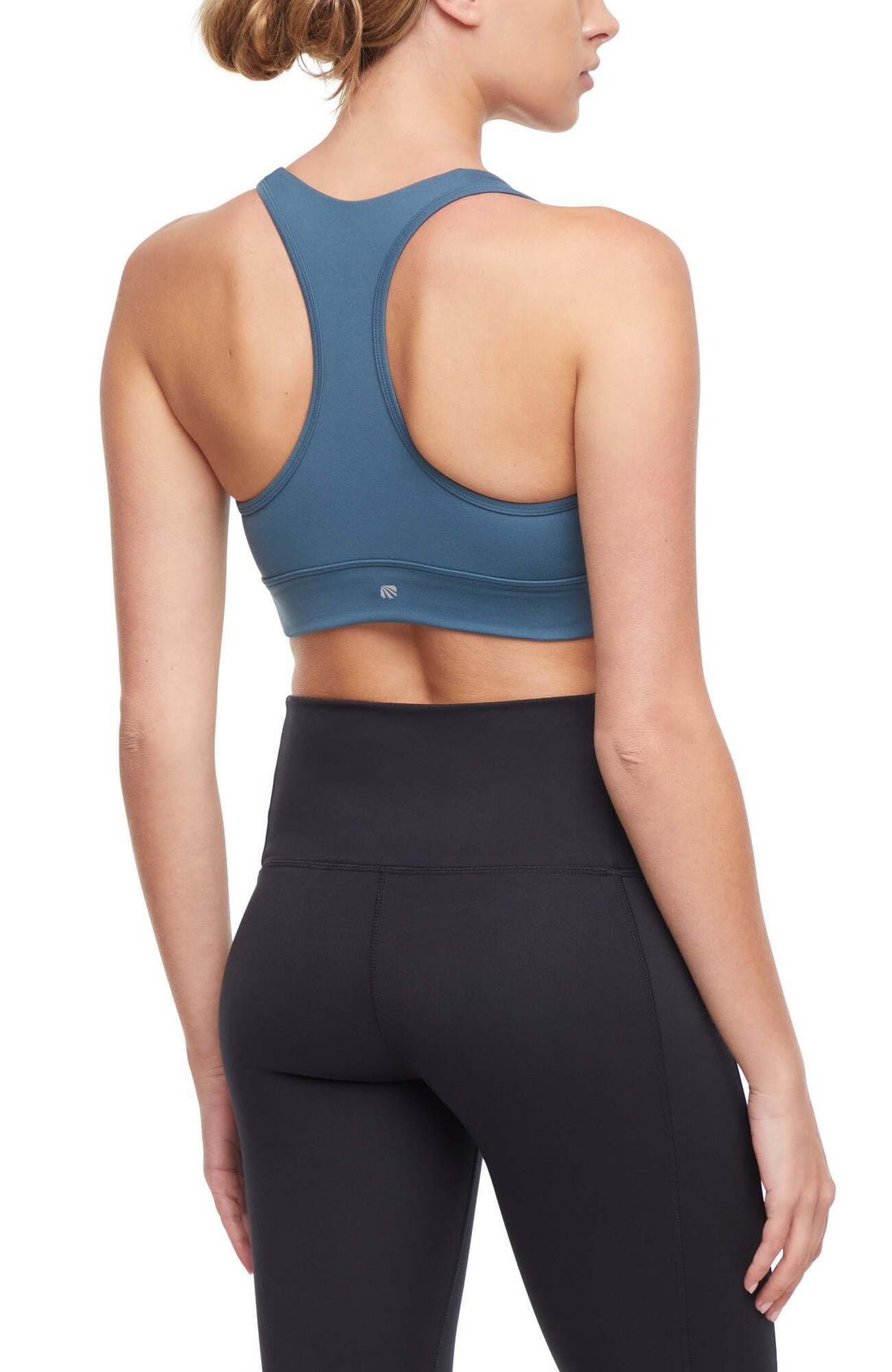 Rubina Sports Bra, side view showing pocket placement, showing visible design features and texture of the soft knit fabric..