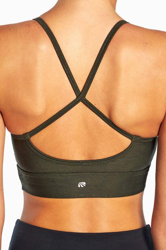 Irene Sports Bra, side view showing pocket placement, showing visible design features and texture of the soft knit fabric..