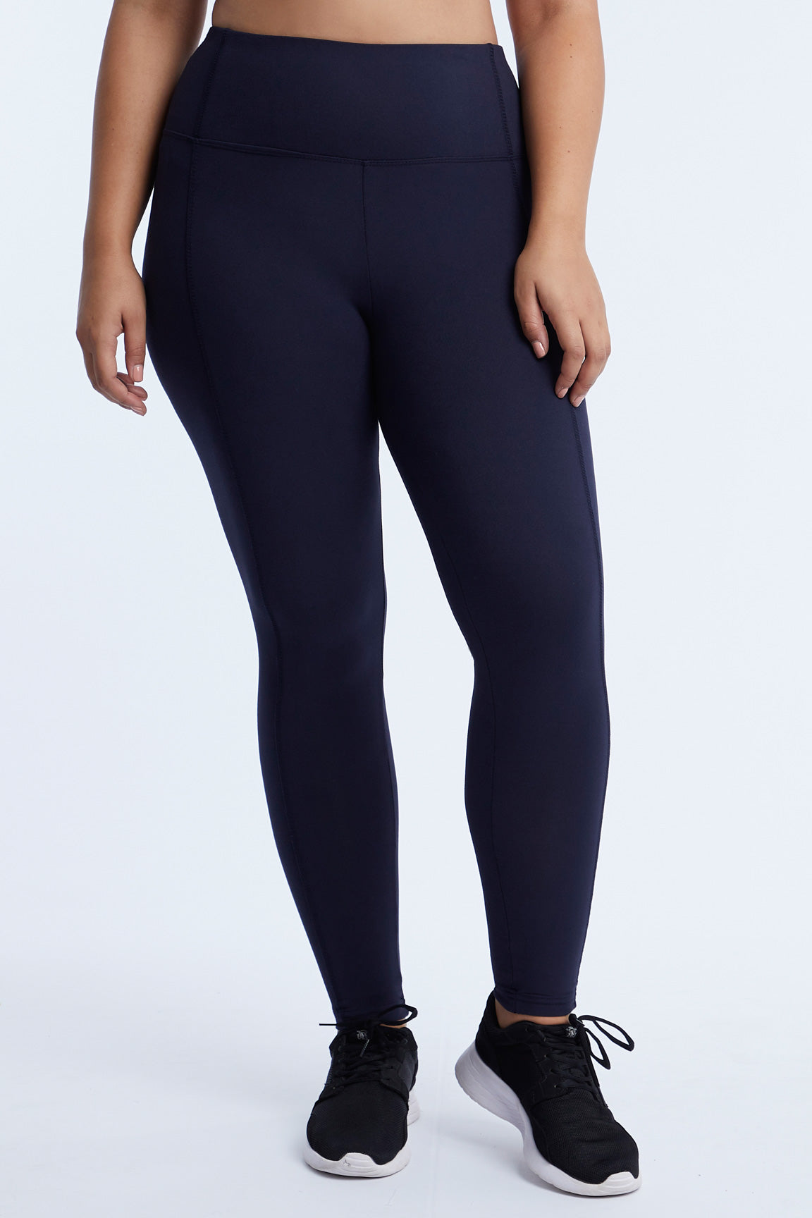 High-Rise Tummy Control Leggings (Plus Size), alternate angle view, showing visible design features and texture of the stretch knit fabric..