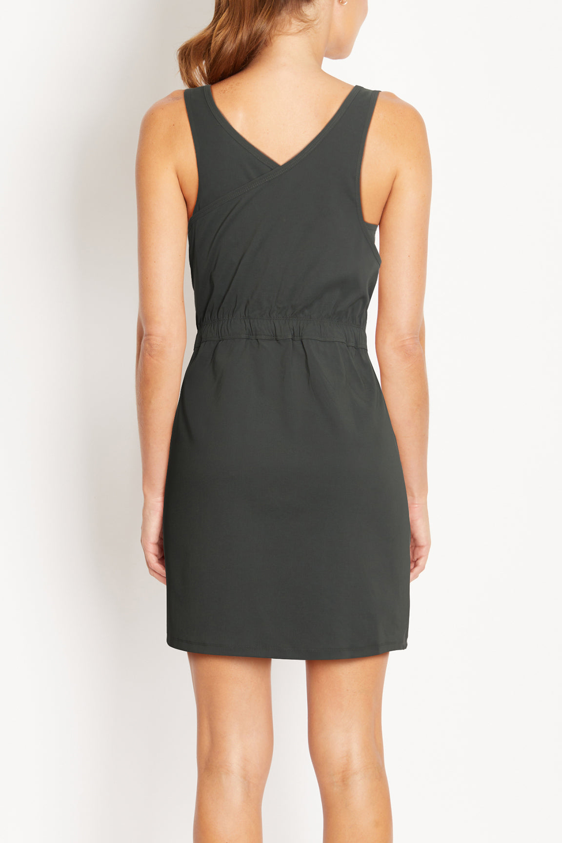 Bristol Dress, side view showing pocket placement, showing visible design features and texture of the soft knit fabric..