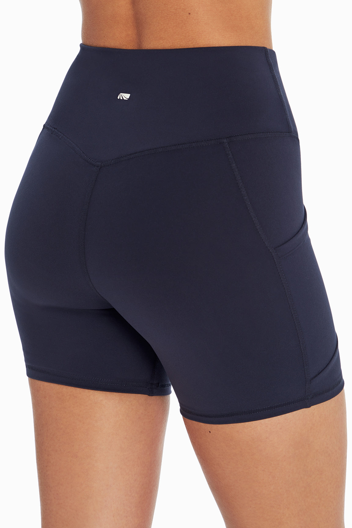 Linnette Side Pocket Tummy Control Short, back view, showing visible design features and texture of the soft knit fabric..