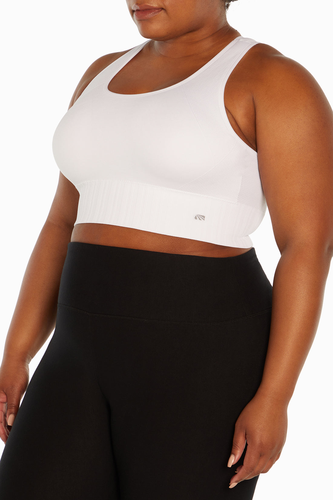 Cathy Seamless Sports Bra (Plus Size), side view showing pocket placement, showing visible design features and texture of the soft knit fabric..