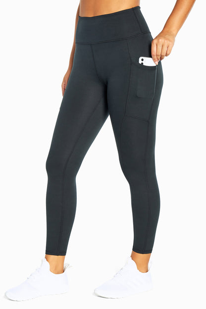 Balance Collection Easy Eclipse Side Pocket Ankle Legging - Black, front view, showing visible design features and texture of the stretch knit fabric.. 
