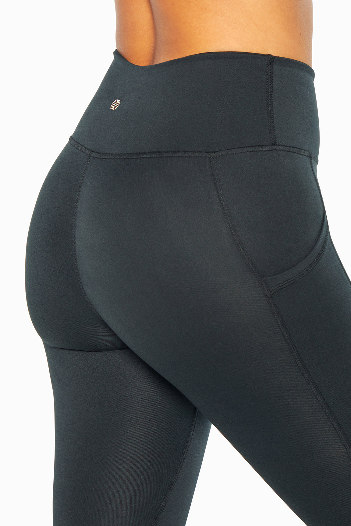 Balance Collection Easy Eclipse Side Pocket Ankle Legging - Black, side view showing pocket placement, showing visible design features and texture.. 