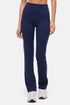 Navy blue leggings worn by a person on a white background. 