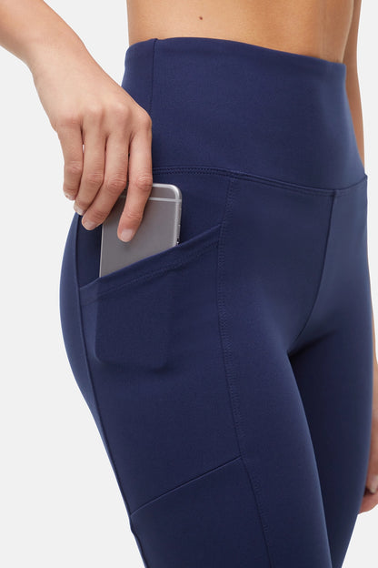 Navy blue leggings with a pocket on a white background. 
