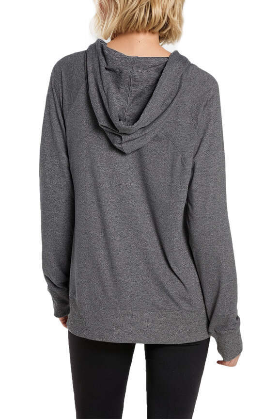 Mona Jacketin White, side view showing pocket placement, showing visible design features and texture of the smooth woven fabric.. 