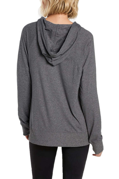 Mona Jacketin White, side view showing pocket placement, showing visible design features and texture of the smooth woven fabric.. 