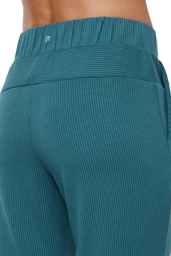 Paige Bootcut Pant, side view showing pocket placement, showing visible design features and texture of the durable stretch fabric.. #color_green-heron