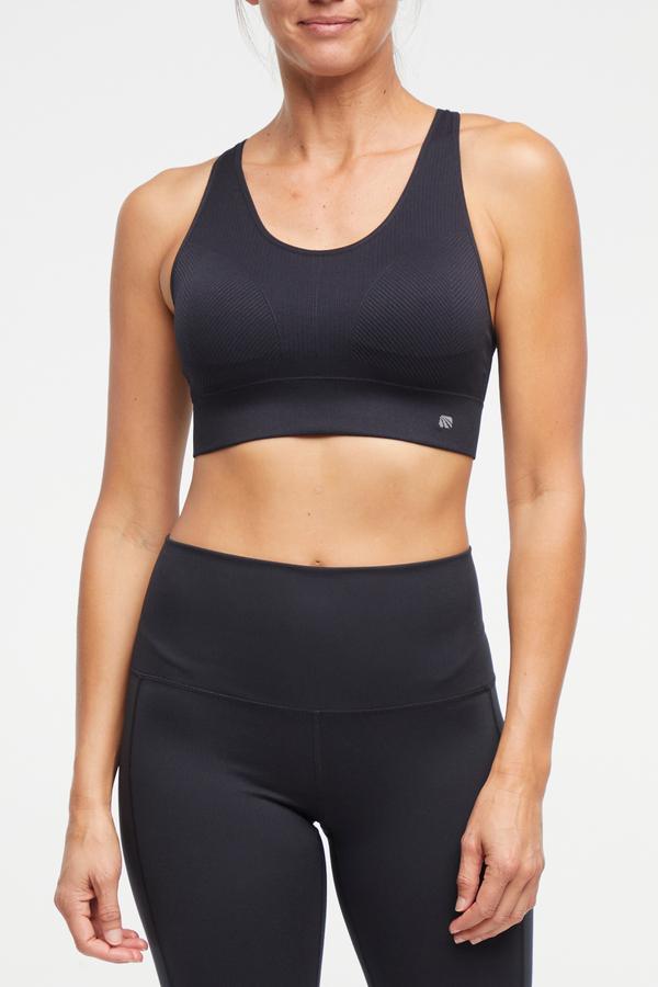 Addie Seamless Sports Bra, alternate angle view, showing visible design features and texture of the soft knit fabric.. 