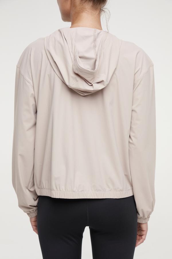 Nori Jacket, alternate angle view, showing visible design features and texture of the smooth woven fabric.. 