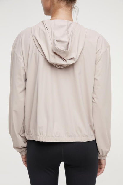 Nori Jacket, alternate angle view, showing visible design features and texture of the smooth woven fabric.. 