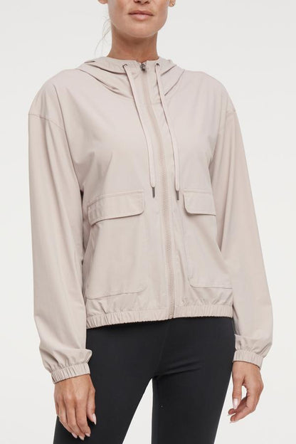 Nori Jacket, alternate angle view, showing visible design features and texture of the smooth woven fabric.. 