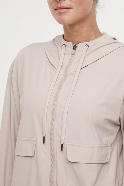 Nori Jacket, alternate angle view, showing visible design features and texture of the smooth woven fabric.. 