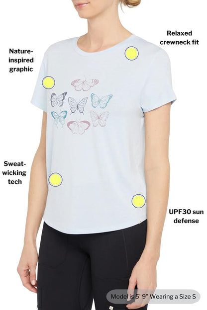 Monica Tee - Heather Skyway Mariposa, back view, showing visible design features and texture of the soft knit fabric.. 