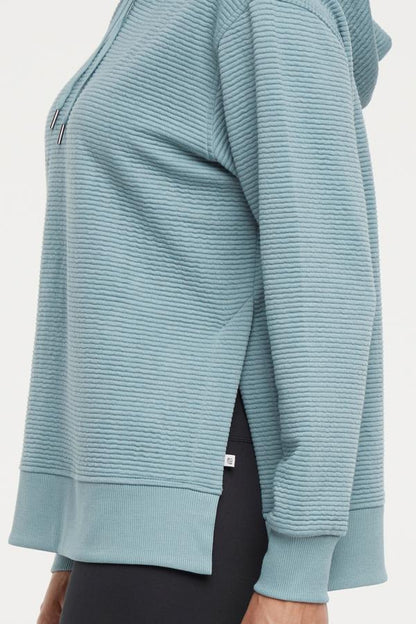 Cora Pullover Hoodie, alternate angle view, showing visible design features and texture of the soft fleece fabric.. 