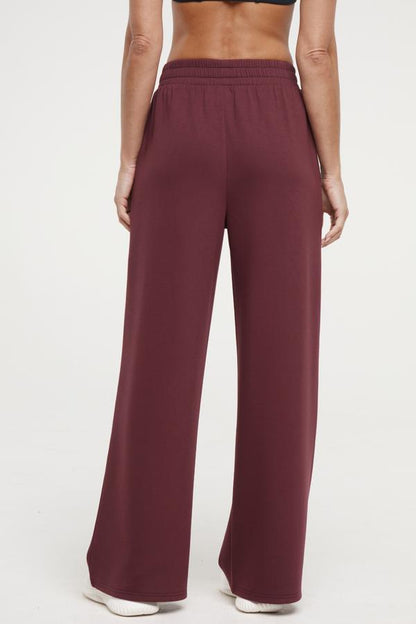 Sage Wide Leg Pant, close-up view of fabric and stitching, showing visible design features and texture of the durable stretch fabric.. 