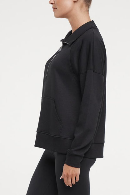 Sage 1/2 Zip, alternate angle view, showing visible design features and texture of the soft knit fabric.. 