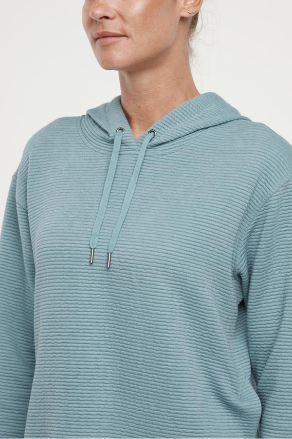 Cora Pullover Hoodie, alternate angle view, showing visible design features and texture of the soft fleece fabric.. 