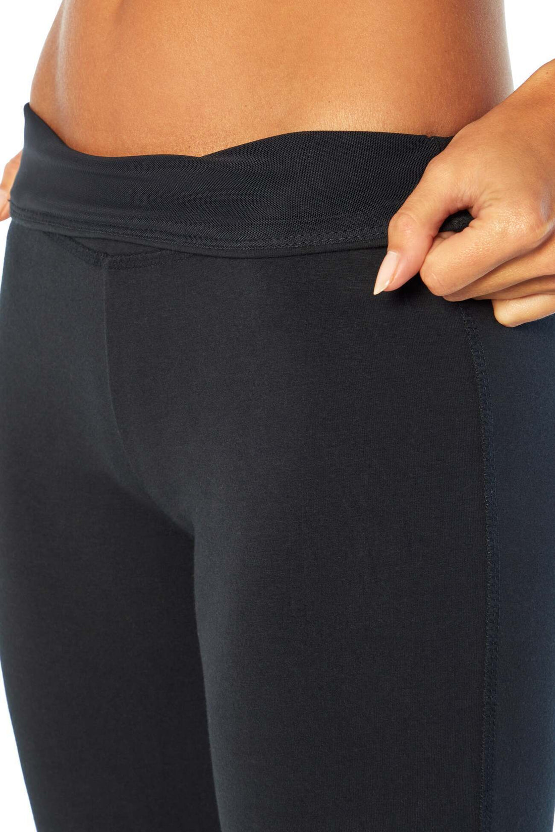 Zoey Tummy Control Capris, close-up view of fabric and stitching, showing visible design features and texture of the soft knit fabric.. 
