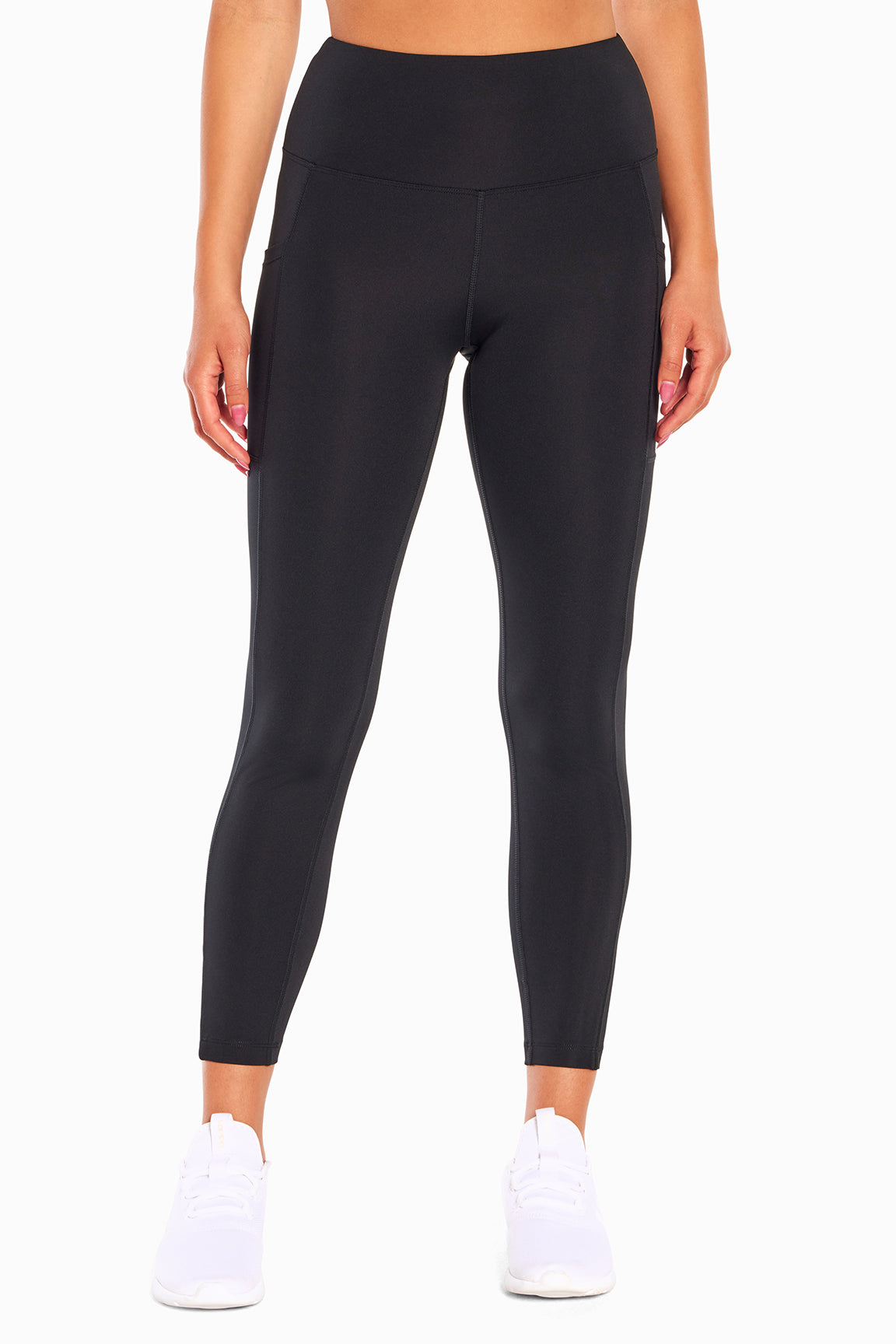 High Rise Side Pocket Ankle Legging - Black, alternate angle view, showing visible design features and texture of the stretch knit fabric.. 