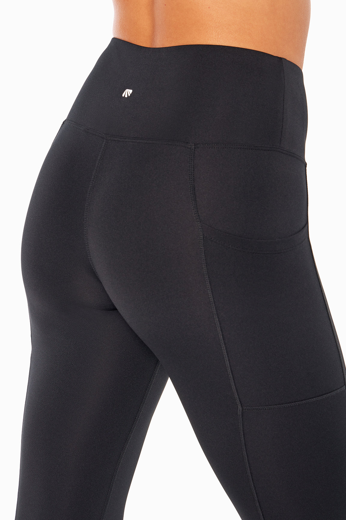 High Rise Side Pocket Ankle Legging - Black, side view showing pocket placement, showing visible design features and texture of the stretch knit.. 
