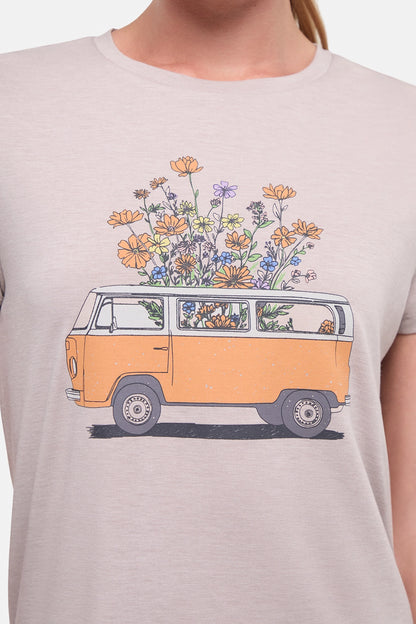 Close up front view of woman wearing a beige t-shirt with a graphic of an orange van and flowers on a .white background. 