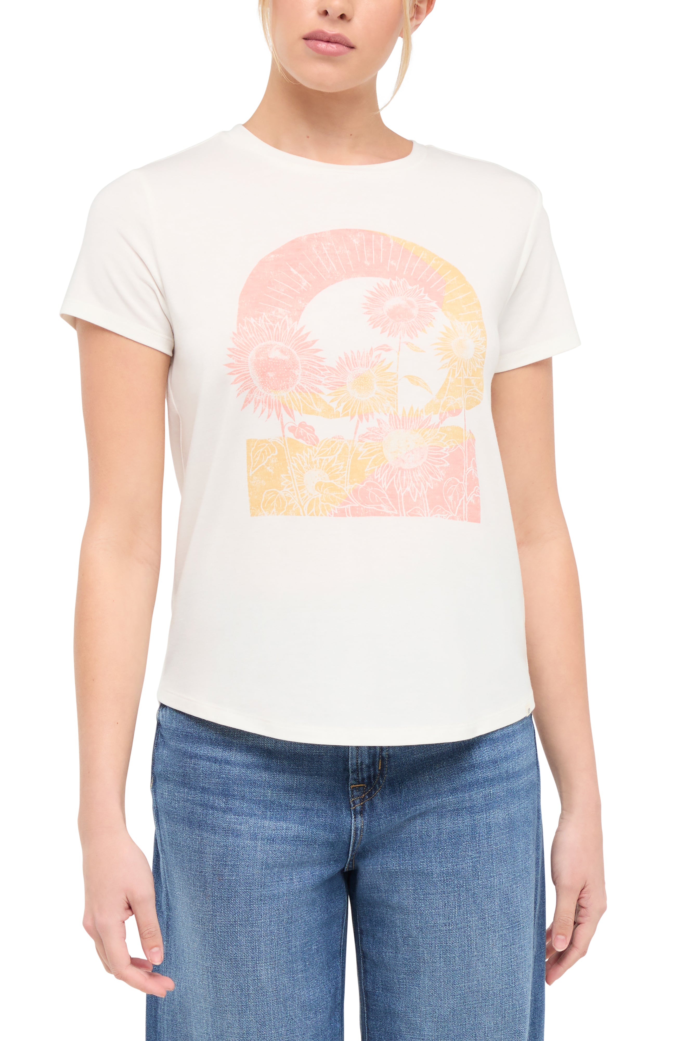 Front view of woman wearing a white t-shirt with colorful tie-dye sunflowers graphic on a white background. 
