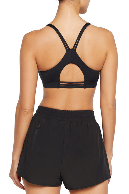 Camilla Sports Bra - Black, alternate angle view, showing visible design features and texture of the soft knit fabric.. 